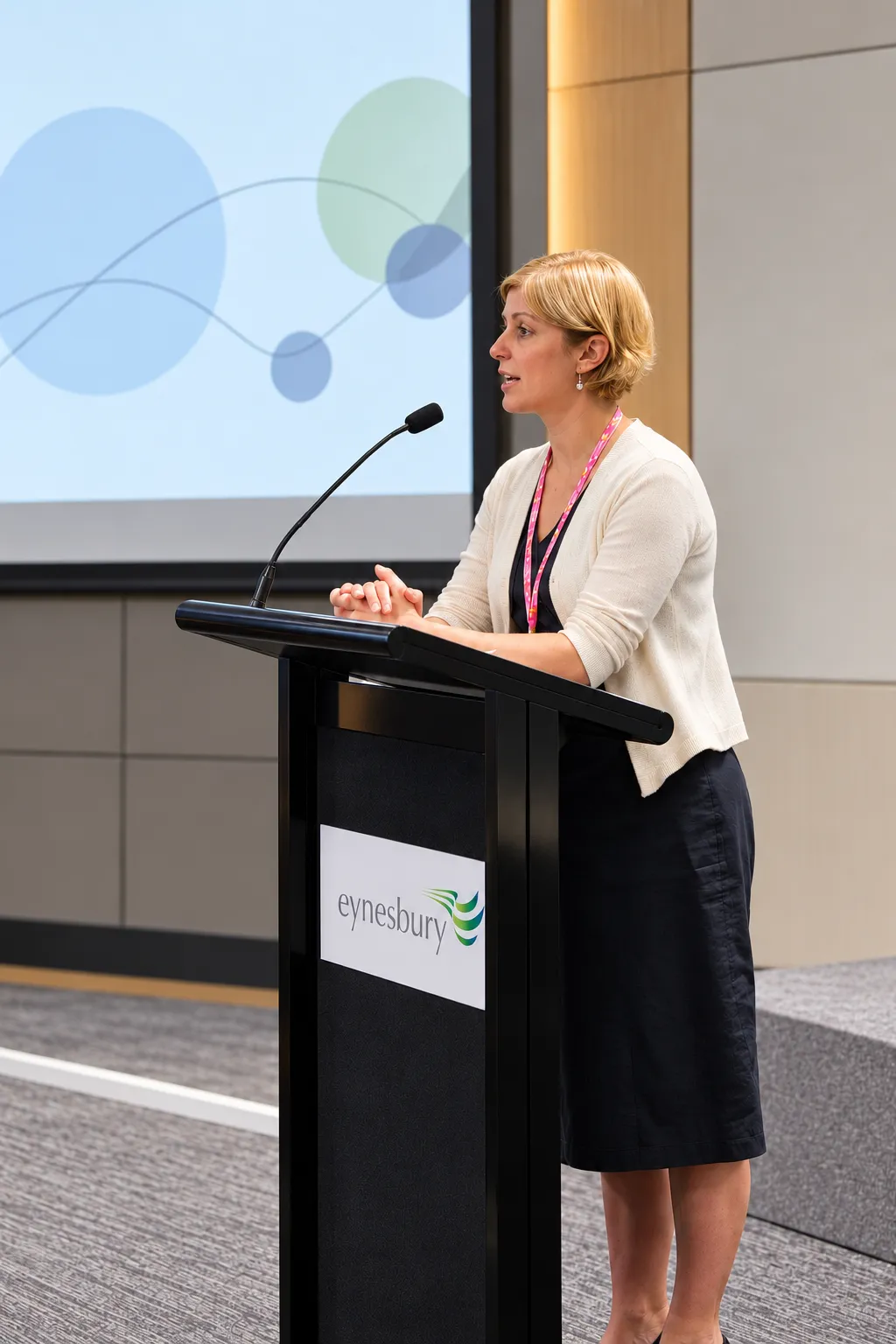 Donna speaking at a lectern