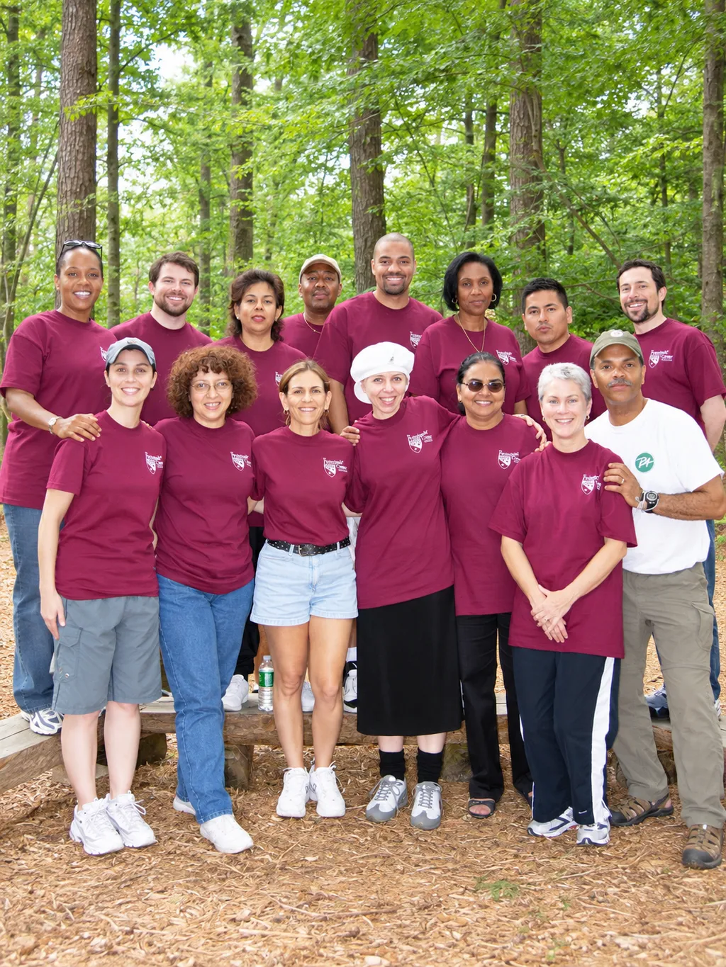 A group of educators in matching T-shirts outdoors