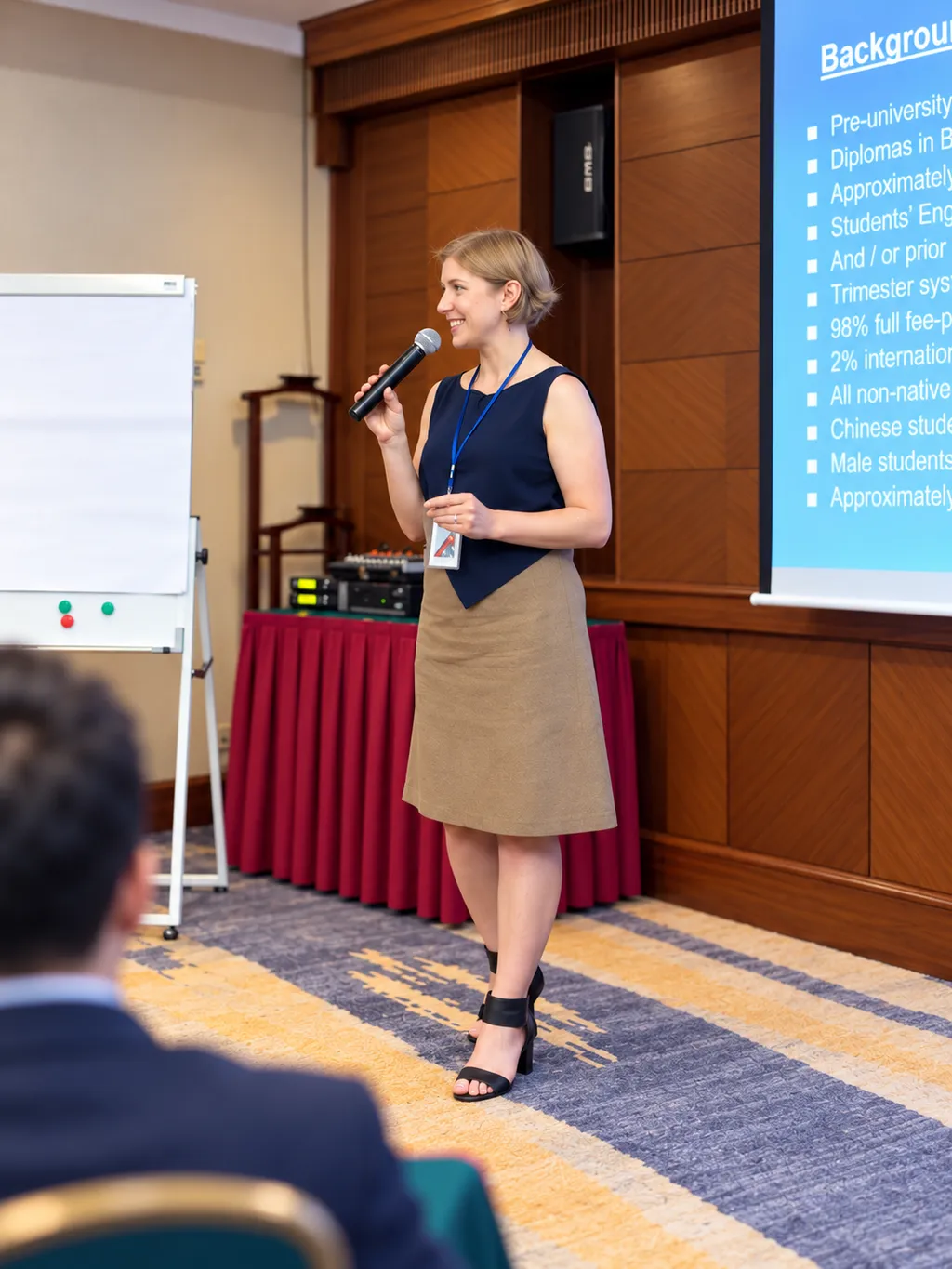 Donna presenting with a microphone