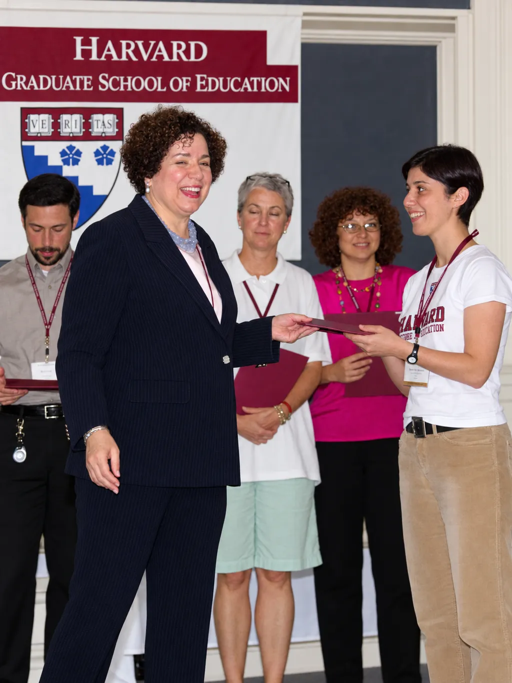 Donna receiving a certificate at the Harvard Graduate School of Education